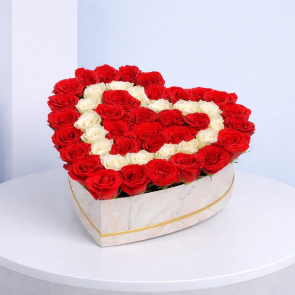 engaging-roses-in-a-heart-box-2026 A heart-shaped box filled with vibrant, fresh roses in various colors, symbolizing love and affection.
