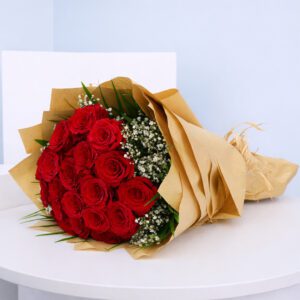 Hand bouquet of vibrant red roses, symbolizing love and elegance, perfect for expressing deep emotions.
