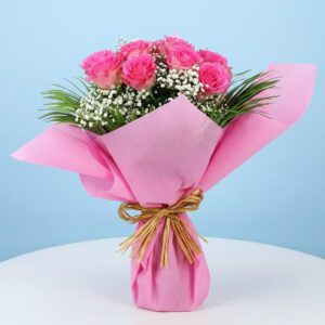 A bouquet of pink roses surrounded by delicate baby's breath, titled Pink shower.