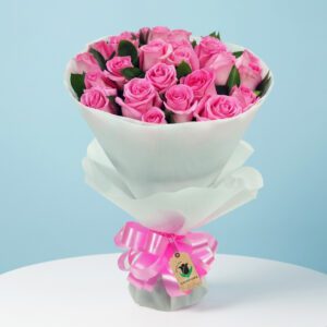A lovely bouquet of pink roses with a ribbon, dedicated to pretty pink for mum.