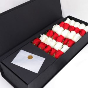 Red and white Roses in a Black Box