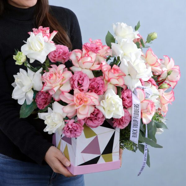 A box containing 10 stems each of red and white roses, 10 pink lisianthus stems, and assorted leaves.