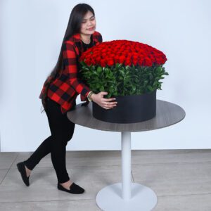 A close-up of vibrant rose blooms in a large arrangement.