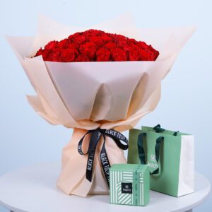 77 red roses paired with premium Patchi chocolates for a luxurious and romantic gift combo.