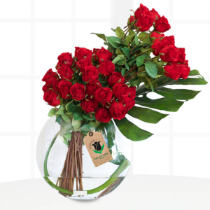 Dramatic and beautifully sculptural the bouquet is made up of red roses with masses greenery, finally, we have given the whole bouquet its luxury.
