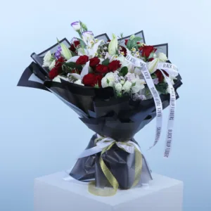 Indulge in the floral fantasy of our Rose and Lily Bouquet, a meticulously crafted arrangement that showcases a stunning array of pink roses, lilies, and spray roses, creating a truly enchanting composition.