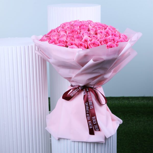 Breathtaking bouquet of 100 fresh light pink roses in an elegant pink wrap.