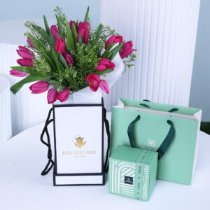 Purple tulip bouquet witha Patchi chocolate gift box anda branded shopping bag