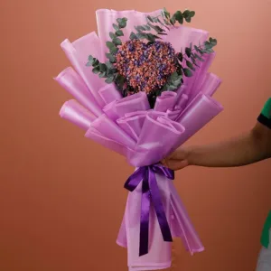 Here is a Heart Shaped Gypsophila made with Sprayed Mix of Colors and Eucalyptus in purple wrapping.