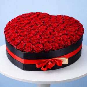 80 red roses arranged in a heart-shaped black box