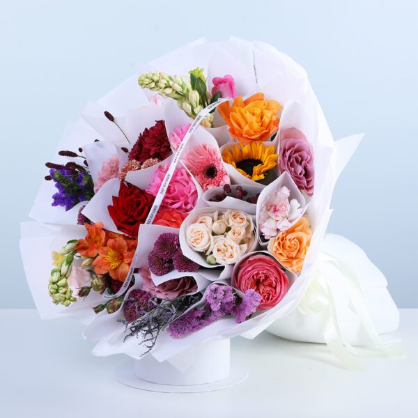 Radiant mixed flower bouquet with roses, sunflower, carnations, lisianthus, chrysanthemum, and fillers, hand-tied for gifting
