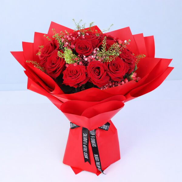 Valentine floral bouquet showcasing 15 red roses and red hypericum