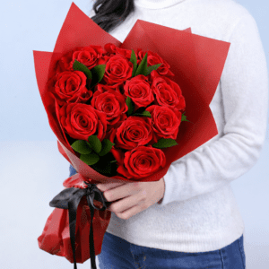 12 stem red roses bouquet with fresh ruscus greenery wrapped elegantly for romantic gifting
