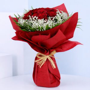 Romantic red rose bouquet and fillers wrapped in red sheet for Valentine gifting