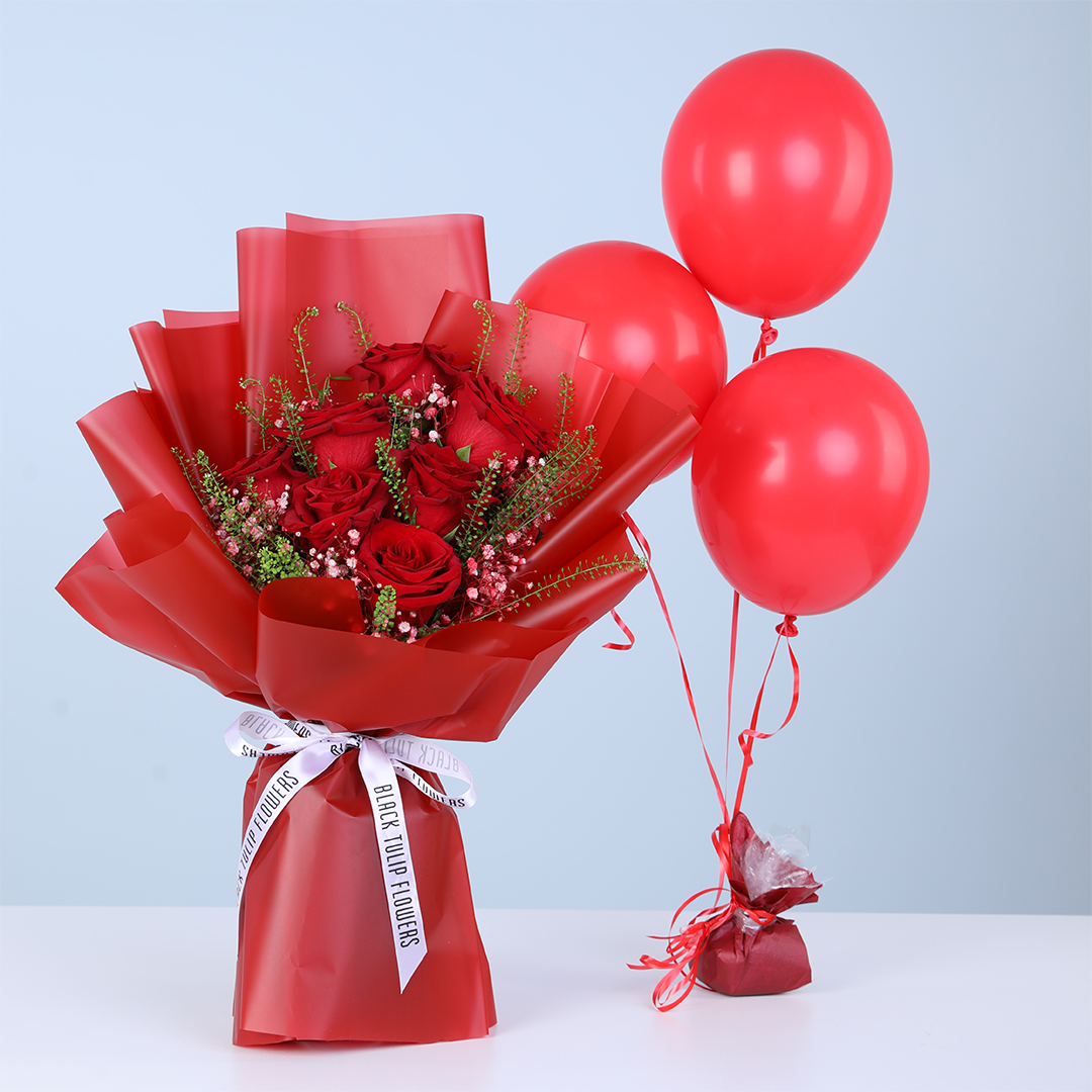 Valentine bloom bouquet with red roses, gypsophila, lipidium, and red balloons