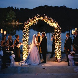 Illuminated Arches show an arch with lights and flowers.