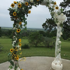 Asymmetrical Floral Arch Design Garden roses, Alcea rosea, floret snapdragons, Grounded Floral Arches.